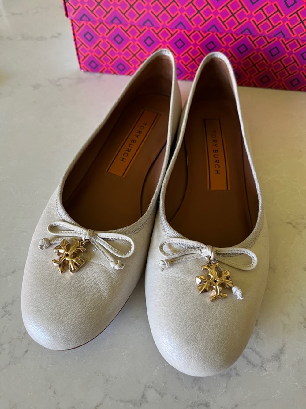 Tory Burch Cream Leather Ballet Flats with Gold Logo Charm in “Rice Paper”
